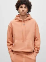 Hugo Cotton-terry Relaxed-fit Hoodie With Logo Patch In Light Orange 899