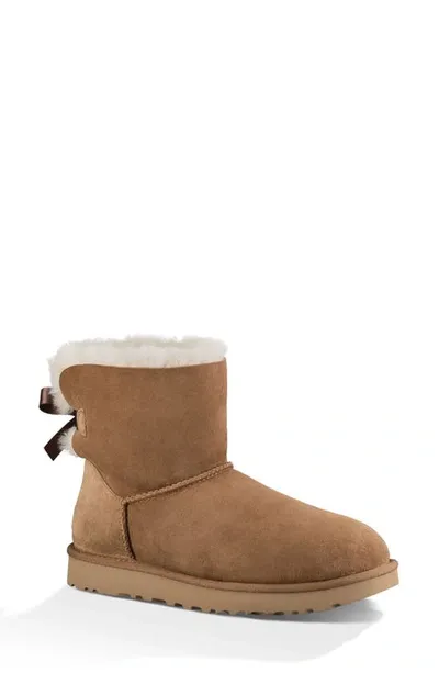 Ugg Mini Bailey Bow Ii Genuine Shearling Bootie In Brown