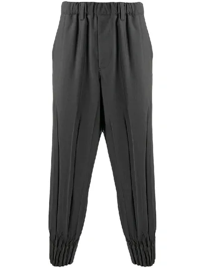 Issey Miyake Pleated Tapered Trousers In Grey