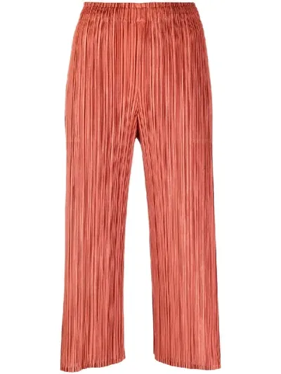 Issey Miyake Plissé Cropped Trousers In Orange