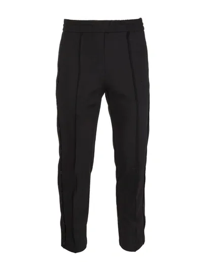 Mcq By Alexander Mcqueen Mcq Alexander Mcqueen Man Black Track Pants With Logo In Darkest Black