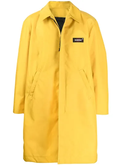 Undercover Eastpak Oversized Logo-appliquéd Nylon Coat In Yellow