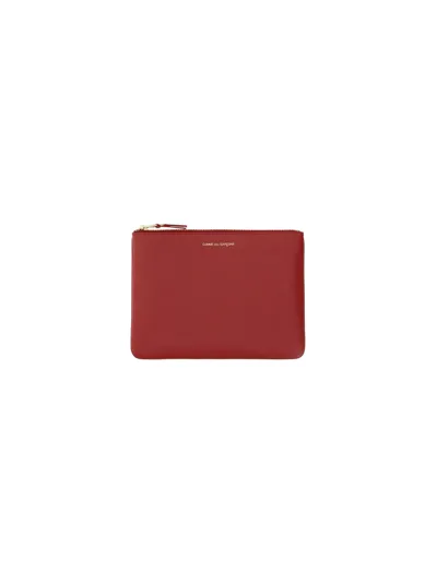 Comme Des Garçons Wallet Logo Print Clutch Bag In Red