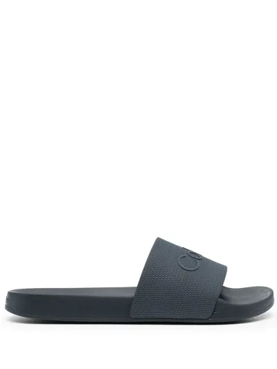 Calvin Klein Debossed-logo Open-toe Slides In Blue