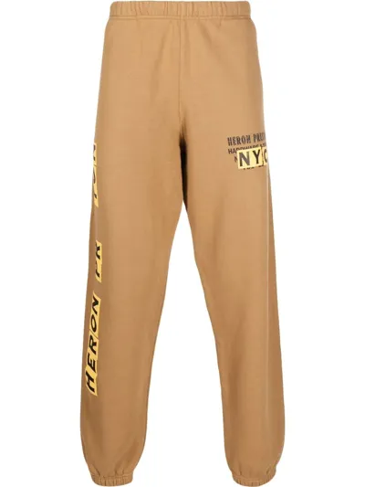 Heron Preston Logo Printed Elasticated Waist Track Pants In Braun