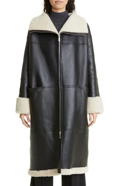 Totême Signature Paneled Shearling Coat In Black,off-white