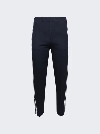 Ami Alexandre Mattiussi Ami Pinstriped Tapered Leg Trousers In Nautic Blue