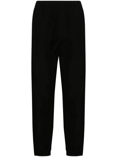 Auralee Tapered-leg Wool Trousers In Black