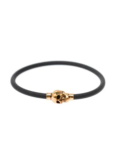 Alexander Mcqueen Black Slip-on Bracelet With Golden-tone Skull Charm In Rubber And Brass In Metallic