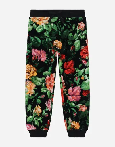 Dolce & Gabbana Chenille Jogging Pants With Rose Print Over A Black Background