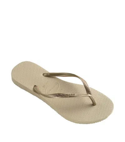 Havaianas Metallic Slim Flip Flops In Gold