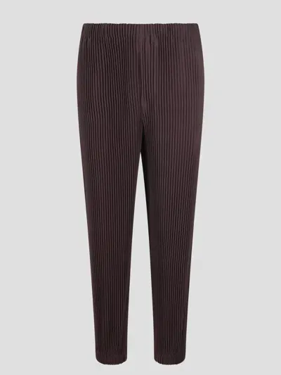 Issey Miyake Cuffed Pleated Trousers In Brown