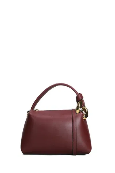 Jw Anderson Logo Debossed Top Handle Bag In Red