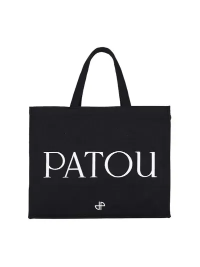 Patou Handbags. In Black