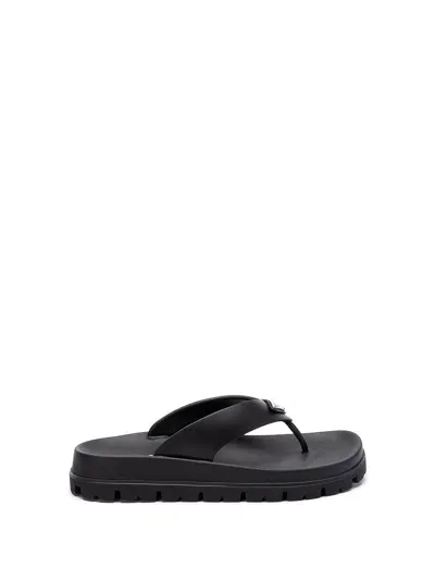 Prada Triangle-logo Flip Flops In Black  