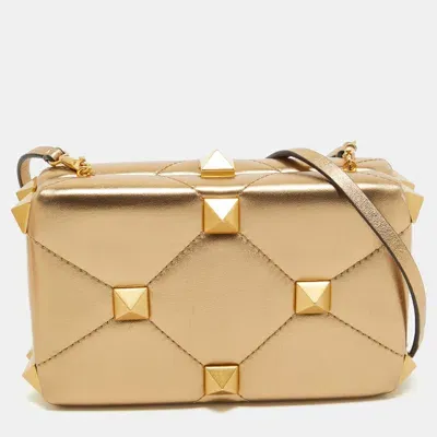 Valentino Garavani Roman Stud Leather Top Handle Bag In Gold