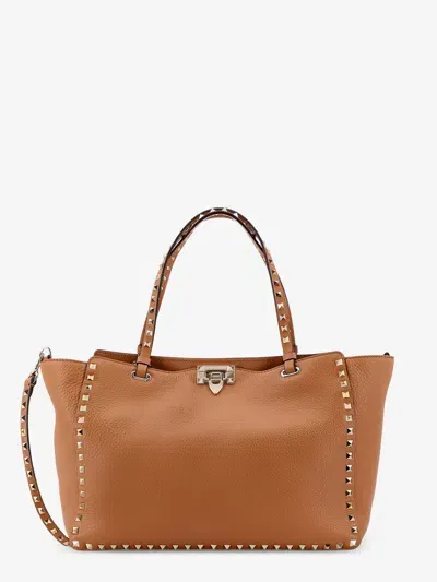 Valentino Garavani Rockstud Medium Top Handle Bag In Brown