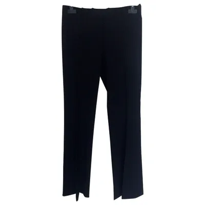 Pre-owned Hugo Boss Wool Trousers In Black