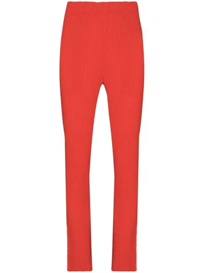 Issey Miyake Ribbed-design Slim-fit Trousers In Red