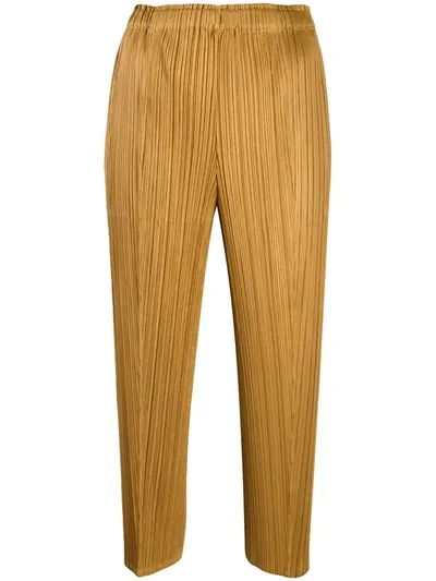 Issey Miyake Cropped Pleated Trousers In Gold